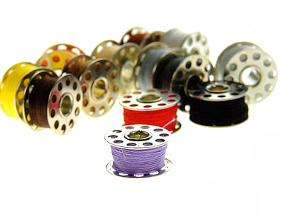 assorted color of sewing threads thumbnail