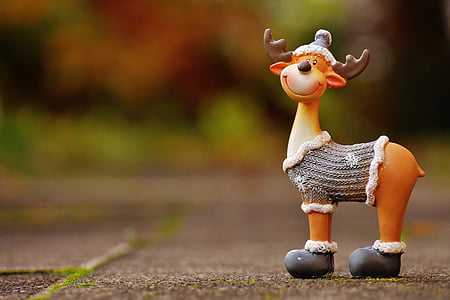 macro photography of reindeer ceramic figurine thumbnail
