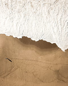 silver-colored chain necklace on brown surface thumbnail