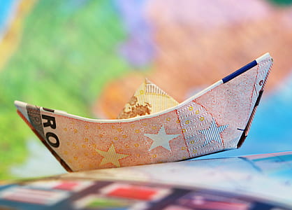 selective focus photo of a banknote boat thumbnail