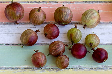 round green and purple fruits on wood thumbnail