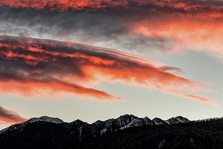 silhouette photo of mountain during golden hour thumbnail