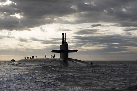 people on submarine in water during daytime thumbnail