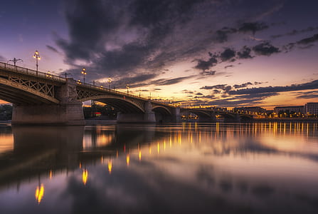 landscape photography of bridge near city building thumbnail