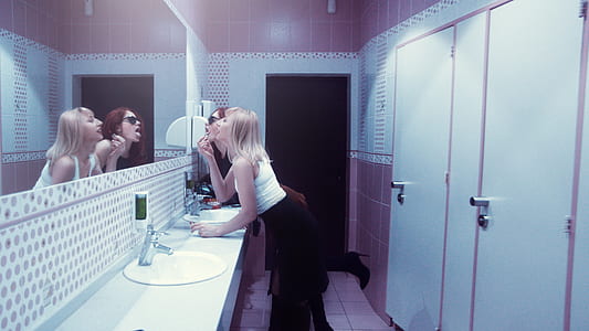woman standing in front of mirror thumbnail