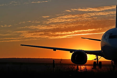 silhouette of airplane during dusk thumbnail
