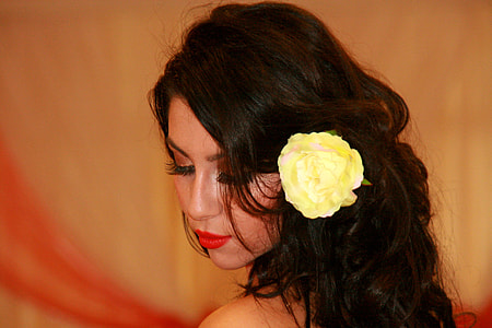 woman with yellow flower on hair thumbnail