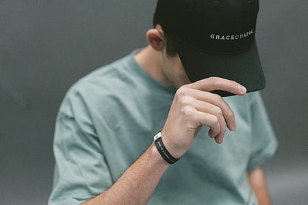 man holding his cap thumbnail