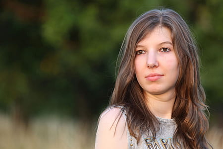 woman in gray tank top in selective focus photography thumbnail