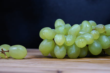 bunch of chardonnay on brown wooden surface closeup photography thumbnail