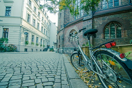 Parked Bicycle Near Building thumbnail