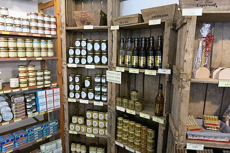 labeled bottles on brown wooden shelf thumbnail