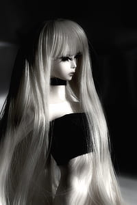 grayscale photo of doll wears black tube shirt thumbnail