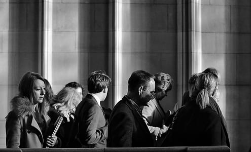 greyscale photography of people inside the building thumbnail
