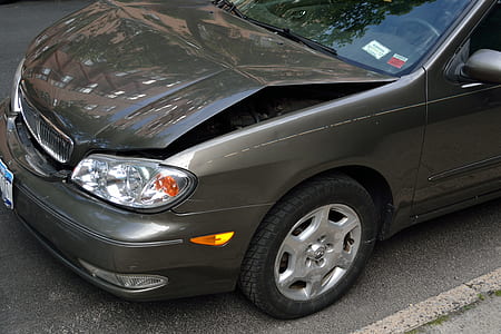 grey vehicle with bent hood thumbnail