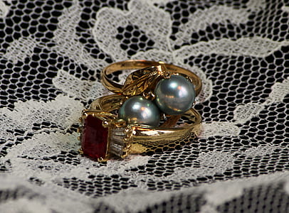 gold-colored rings on white textile thumbnail