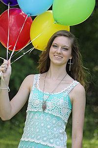 women's teal and white sleeveless top holding assorted color of balloons thumbnail
