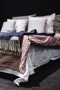 Beds with pillows on a designer exhibition thumbnail