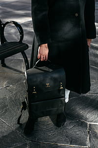 Person Holding Black Leather Backpack thumbnail