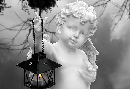 white angel statue holding light lantern thumbnail