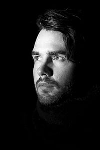 grayscale photo of mans face thumbnail