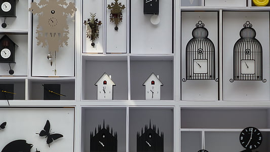 wall clocks on white painted wall thumbnail