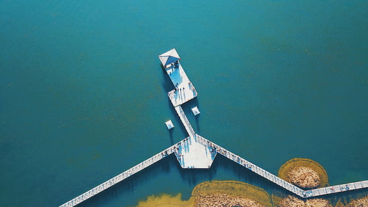 white dock on body of water thumbnail
