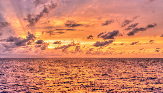 sea under gray clouds at golden hour thumbnail