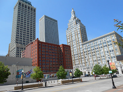 high angle photo of three grey and brown concrete buildings during daytime thumbnail