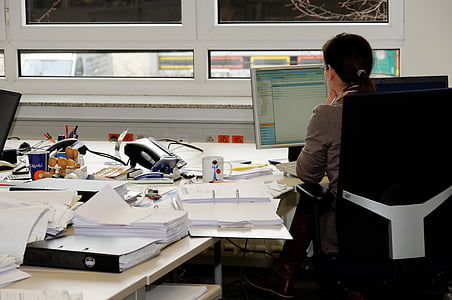 woman wearing gray blazer in front of computer thumbnail
