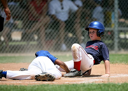 focus photo of two baseball player boys thumbnail