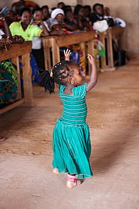 girl wearing dress dancing in front of people thumbnail