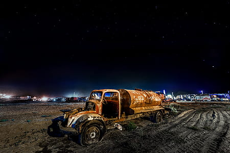 vintage brown fuel tank on mud thumbnail