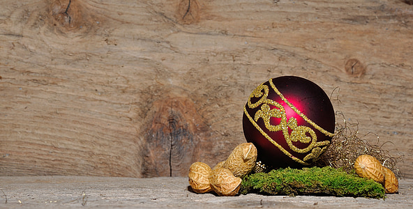 red and gold bauble surrounded with peanuts thumbnail