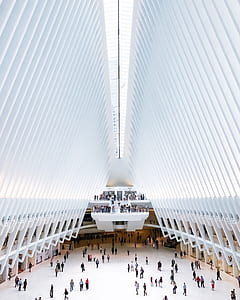people walking inside white building thumbnail