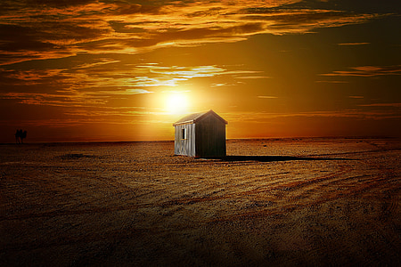 gray wooden house during sunset thumbnail