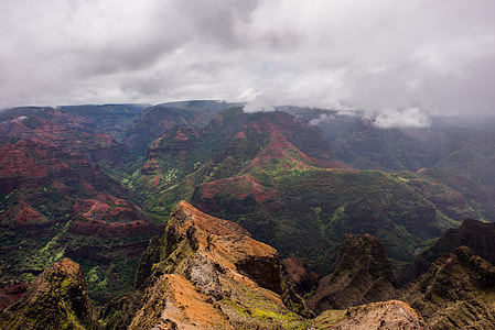 green and beige mountains aerial view during daytime thumbnail