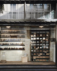 brown wooden shelf with bottles and boxes photo thumbnail