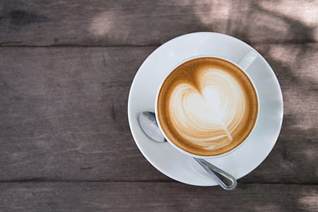 White Ceramic Cup on Saucer thumbnail