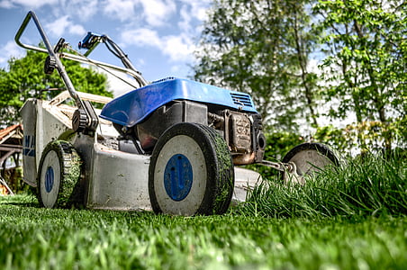 low angle photography of blue and black push mower thumbnail