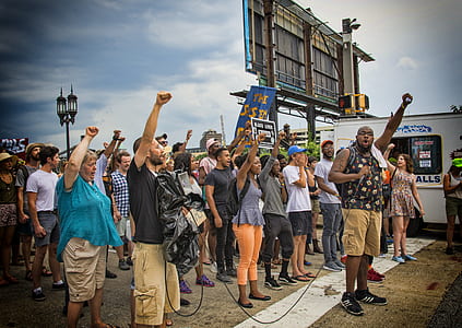 people raising their fist up in the air thumbnail