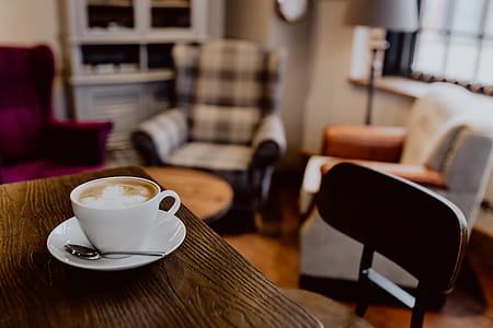 Cup of coffee on table in cafe thumbnail