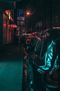 cars parked near building and parking signage thumbnail