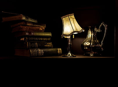 photo of white table lamp near books thumbnail