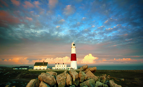 light house tower under gray cirrus clouds during sunset thumbnail