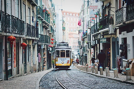 photo of tram train on rail near building thumbnail
