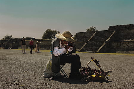 man sitting on Mayan ancient ruins thumbnail