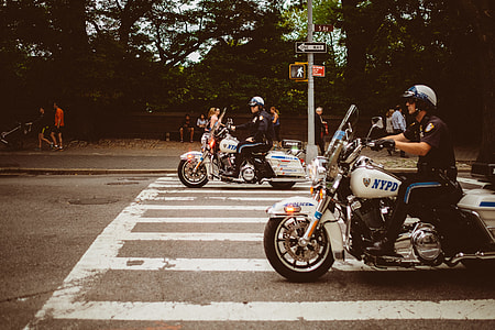 two policemen riding motorcycle on pedestrian lane thumbnail