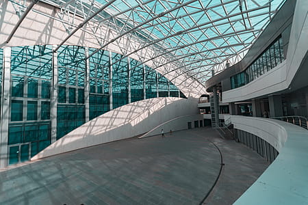 Person Walks Inside Glass Structure thumbnail