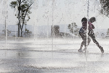 person walking in area filled with water thumbnail